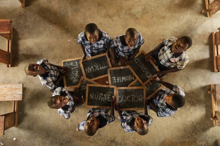 A-group-of-students-in-show-off-their-desired-professions-when-they-grow-up-photographer-in-kenya