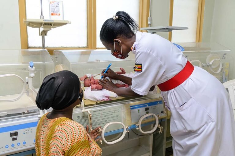 A-health-worker-from-the-ministry-of-health-in-Uganda-examins-a-newborn-baby-in-an-incubator-is-part-of-an-exercise-to-improve-maternal-health-in-remote-areas-photographer-in-kenya
