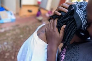 A-lesbian-couple-comforts-each-other-after-a-scuffle-with-the-neighbours-about-their-sexuality-in-makindyeUganda