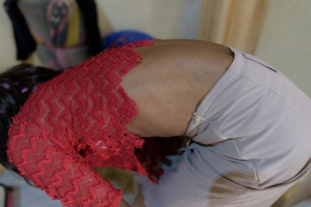 A-transgender-man-changes-into-his-feminine-outfit-in-mpererweUganda-privately-amid-persecutionof-the-LGBTQ-communty