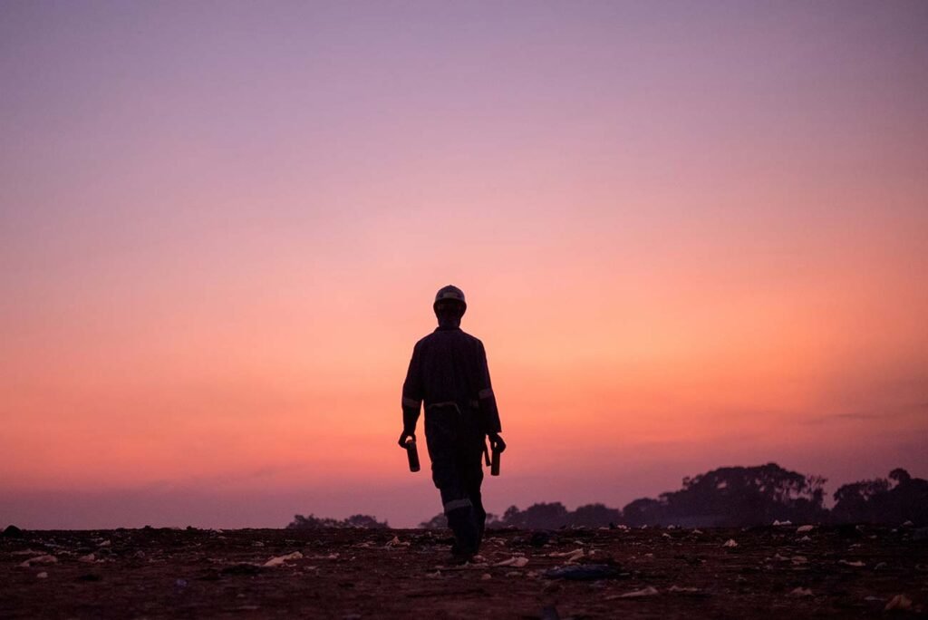 Gabbage-collector-walks-home-after-a-long-day-inkiteezi-kampala