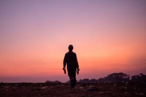 Gabbage-collector-walks-home-after-a-long-day-inkiteezi-kampala